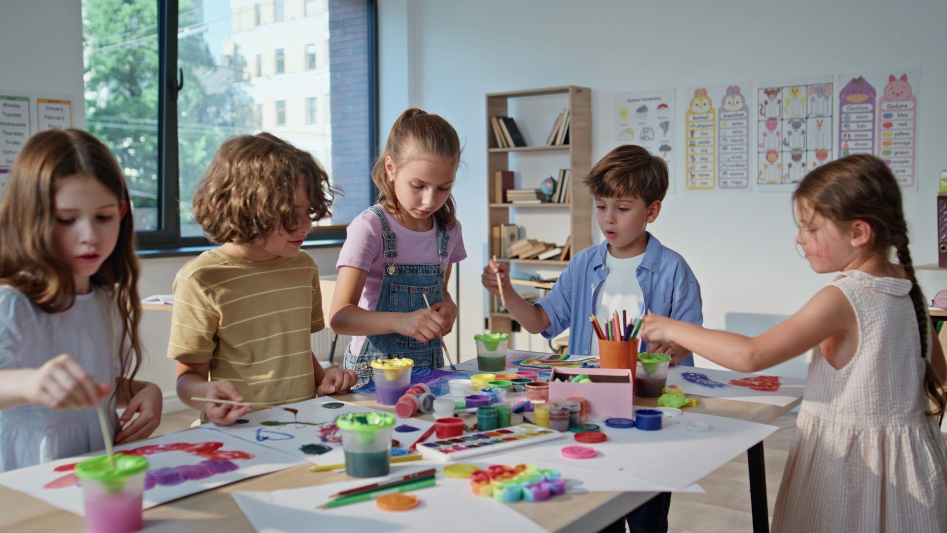 Pupils creating colorful art at collaborative workshop with vibrant materials.